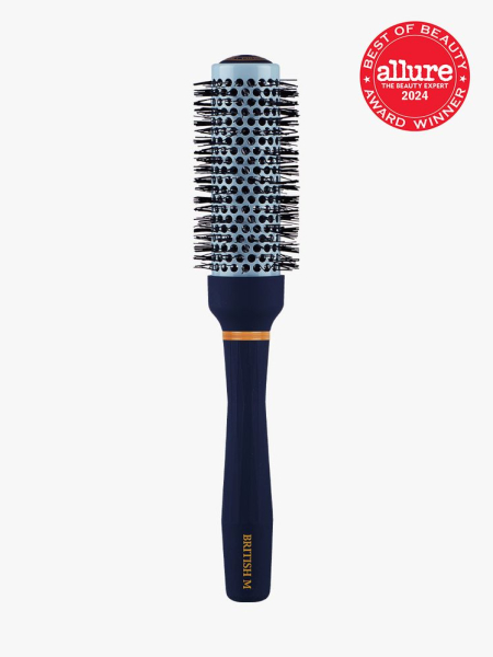 ceramic brush in navy and gold color way on light gray background with red and white 2024 allure best of beauty seal